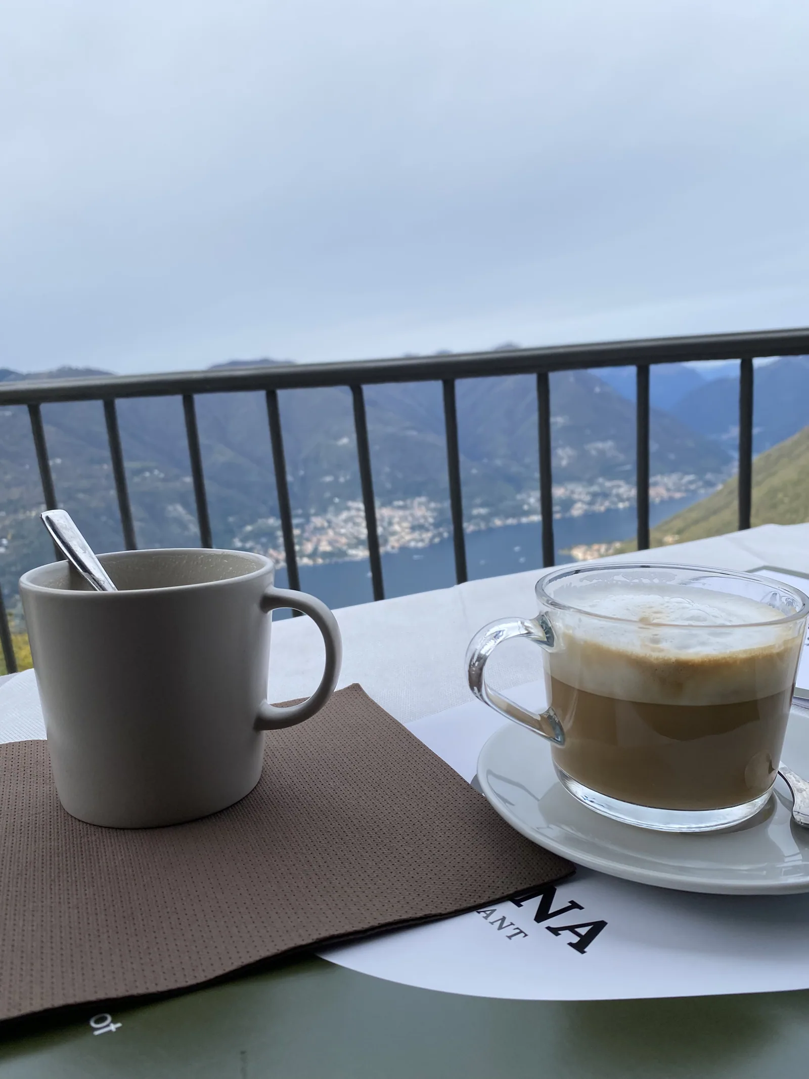 Cappuccino on a balcony overlooking Lake Como