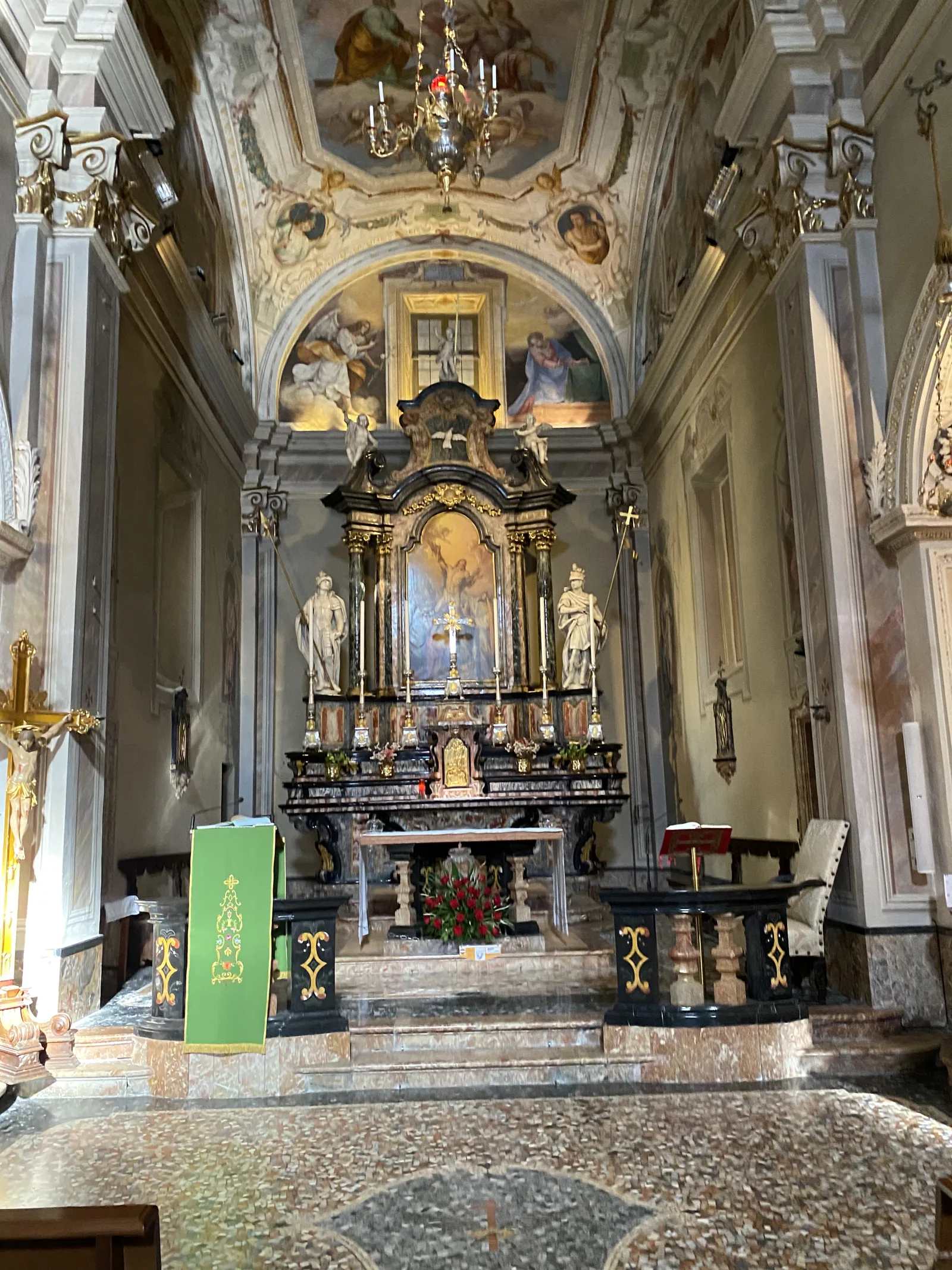 The ornate painted interior of a small church on Lake Como