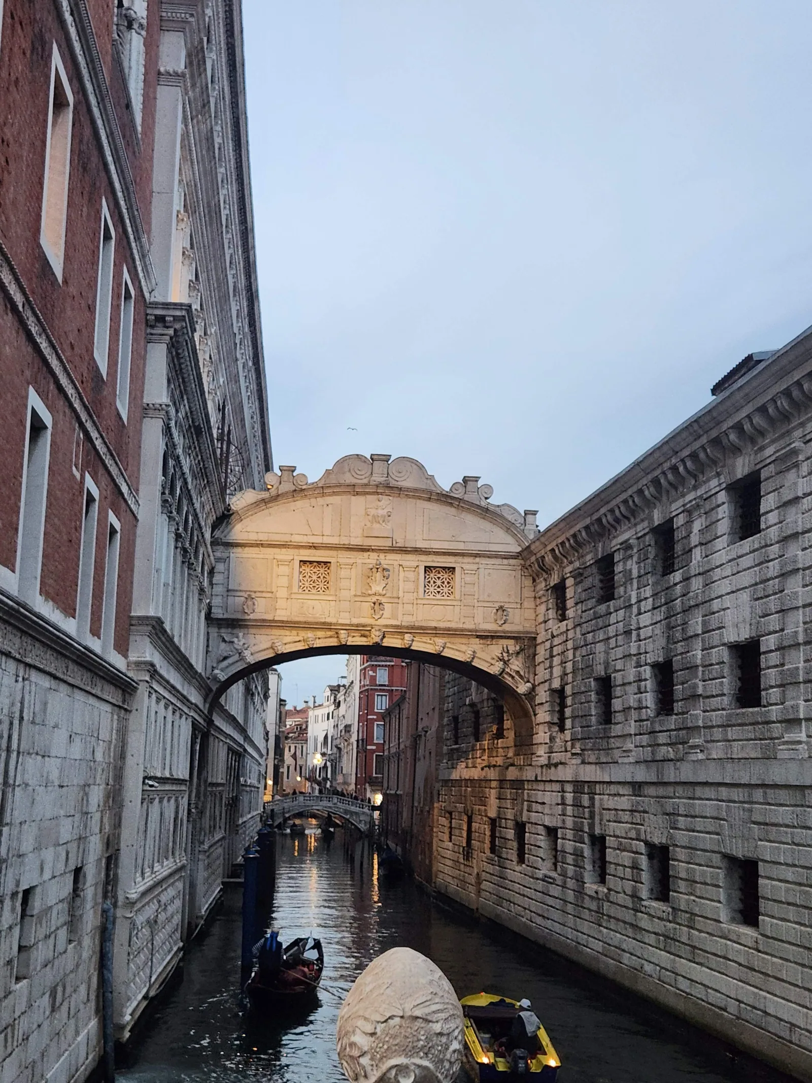 The Bridge of Sighs over a narrow canal in Venice