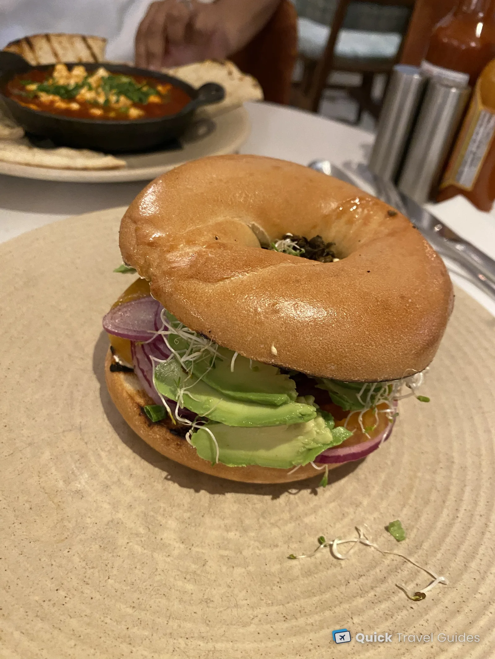 Avocado bagel with red onion, tomato and sprouts at the Kimpton Canary, Santa Barbara