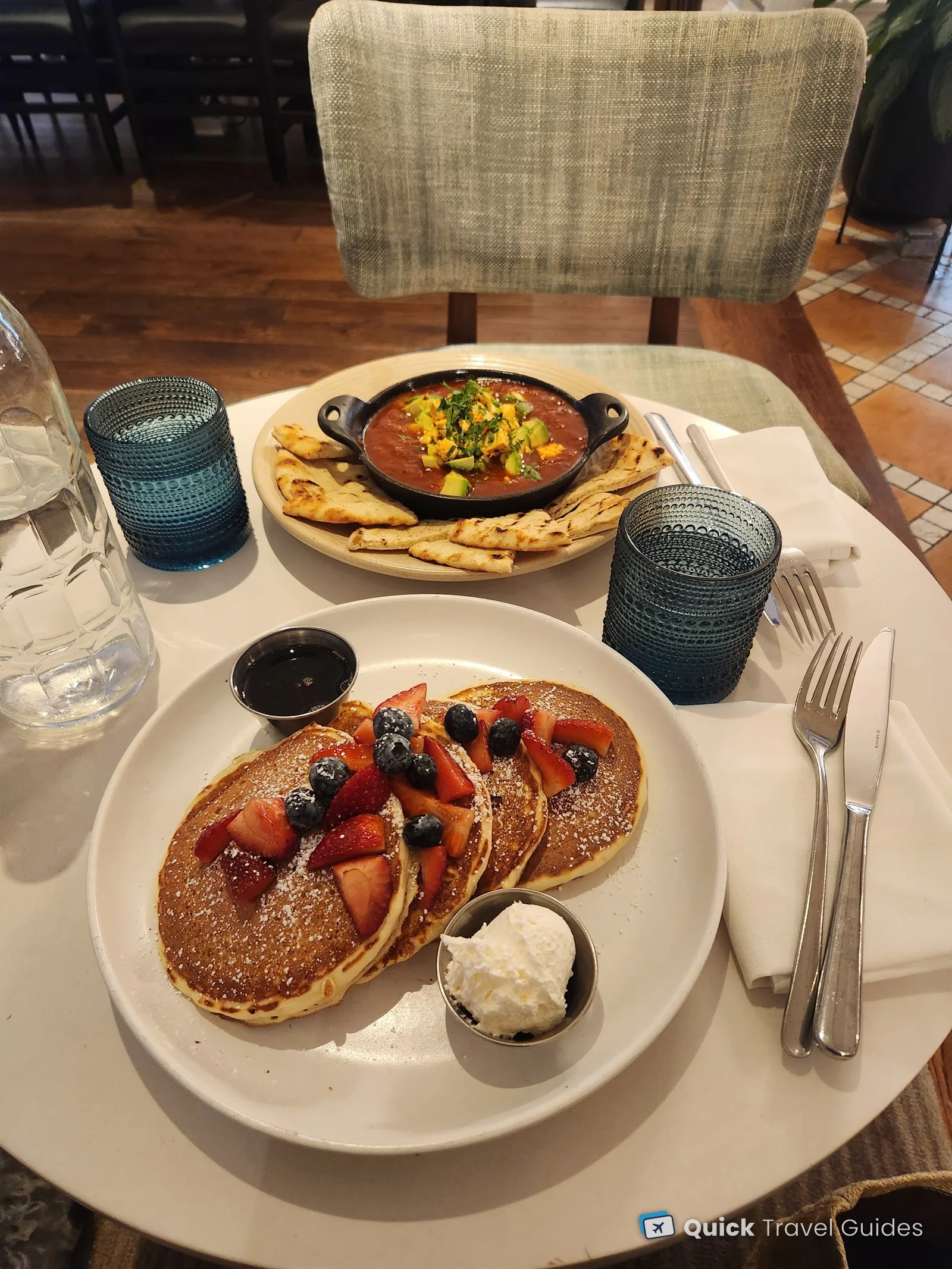 Pancakes with strawberries and blueberries, and a vegetarian shakshuka with pita, for breakfast at the Kimpton Canary in Santa Barbara