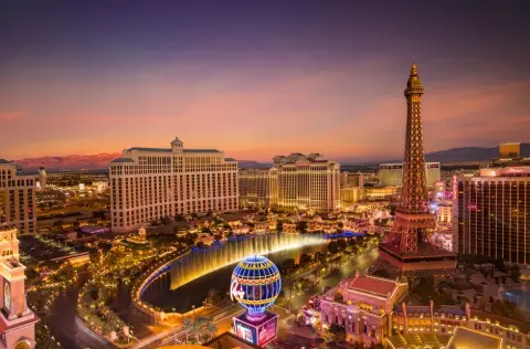 The Bellagio fountains and the Las Vegas Strip at dusk