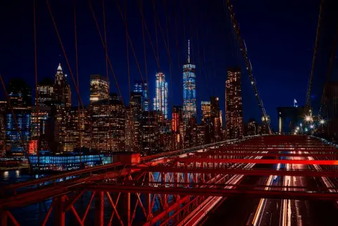 The Manhattan skyline at night from the Brooklyn Bridge